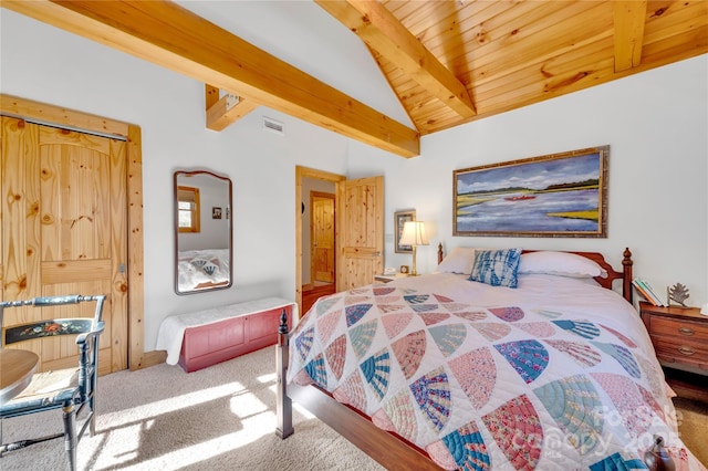 carpeted bedroom featuring wooden ceiling, a closet, and lofted ceiling with beams