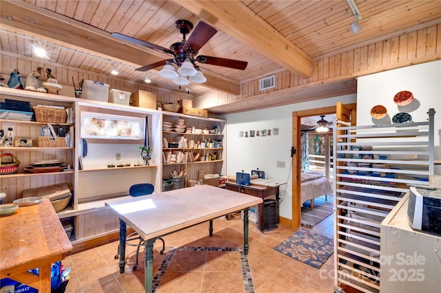 tiled office space with wood ceiling, rail lighting, and beam ceiling