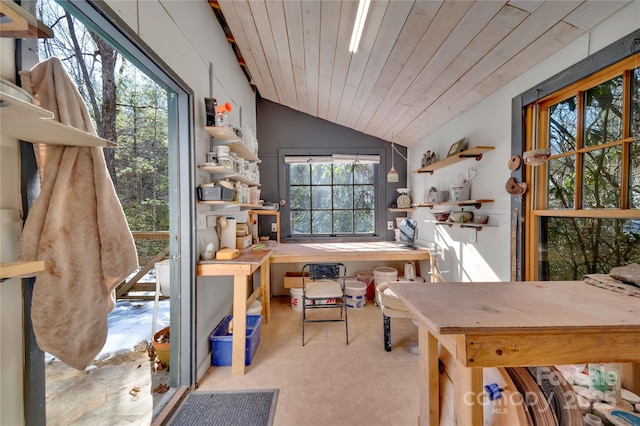 office featuring vaulted ceiling, wood ceiling, and a workshop area