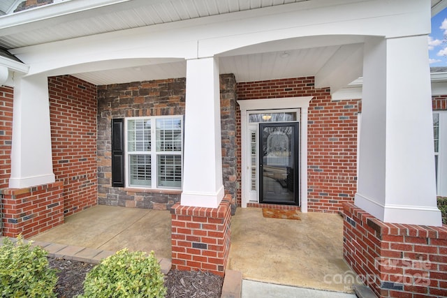 doorway to property featuring a porch