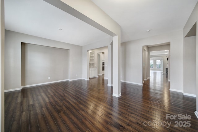 unfurnished room featuring dark hardwood / wood-style flooring