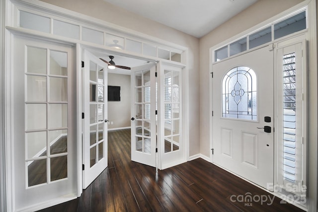 foyer with dark wood-type flooring, french doors, and ceiling fan