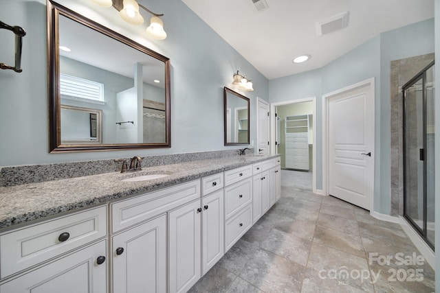 bathroom with vanity and an enclosed shower