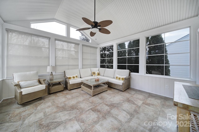 unfurnished sunroom featuring ceiling fan and vaulted ceiling