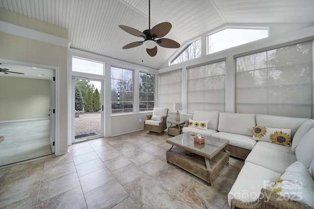 sunroom featuring vaulted ceiling, ceiling fan, and plenty of natural light