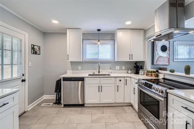 kitchen with pendant lighting, white cabinetry, sink, island exhaust hood, and stainless steel appliances