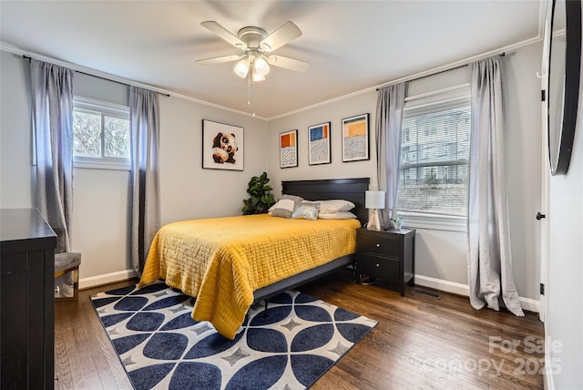 bedroom with ornamental molding, dark hardwood / wood-style floors, and ceiling fan