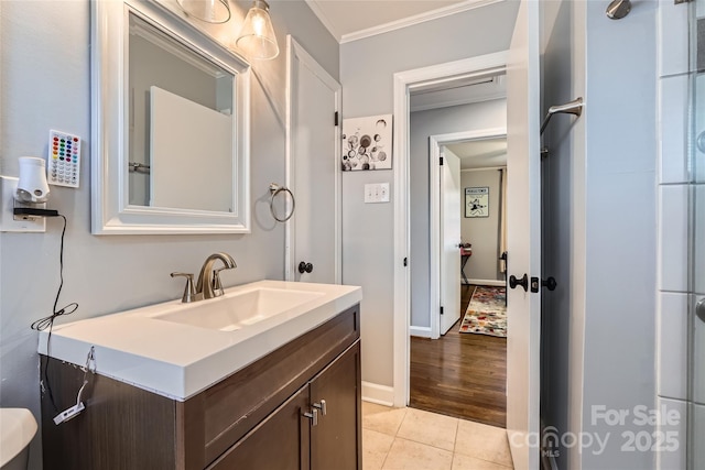 bathroom with vanity, tile patterned flooring, and crown molding