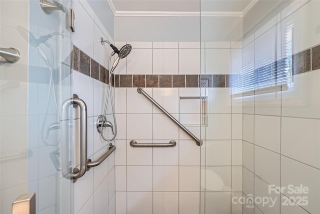 bathroom featuring crown molding and an enclosed shower