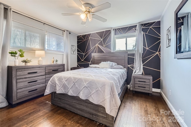 bedroom with crown molding, ceiling fan, and dark hardwood / wood-style floors