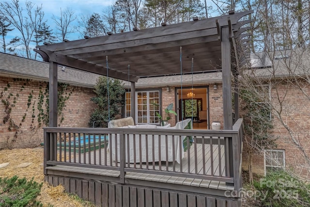 wooden deck featuring a pergola