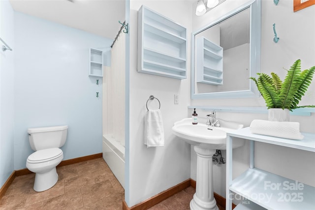 bathroom with shower / bath combo and toilet