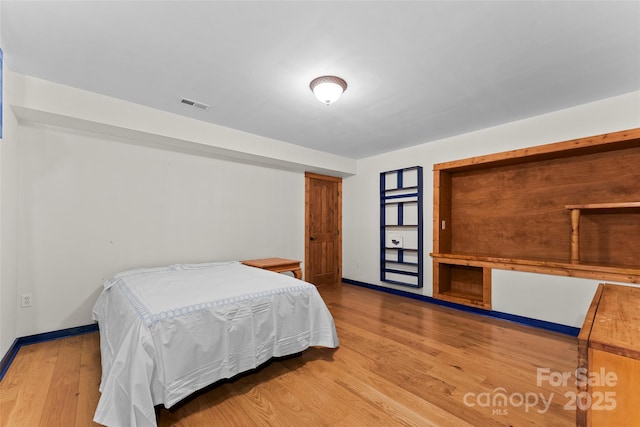 bedroom featuring wood-type flooring