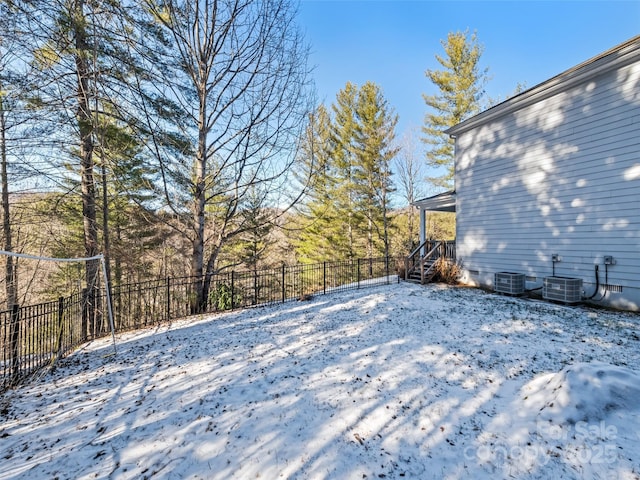 snow covered deck featuring central AC