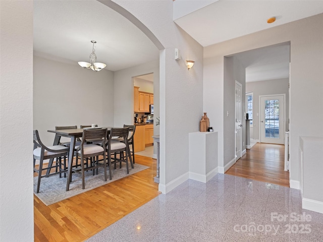 dining space featuring a chandelier