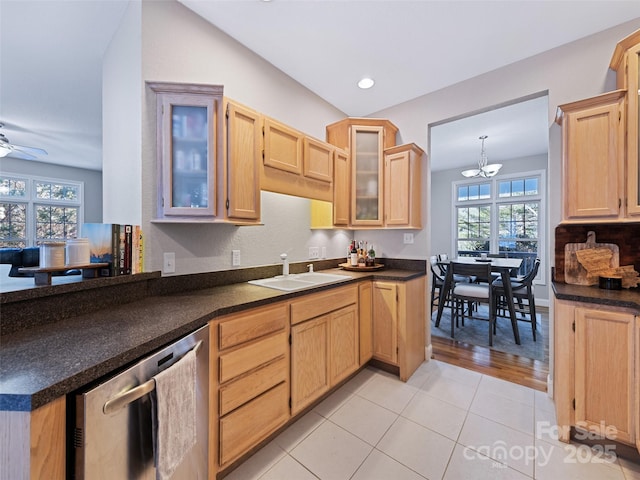 kitchen with ceiling fan with notable chandelier, dishwasher, light brown cabinetry, sink, and light tile patterned flooring