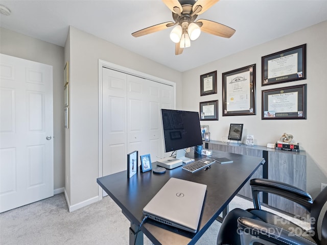 office with ceiling fan and light colored carpet