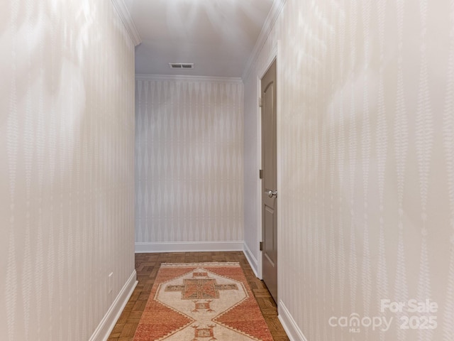 hallway with crown molding and parquet floors