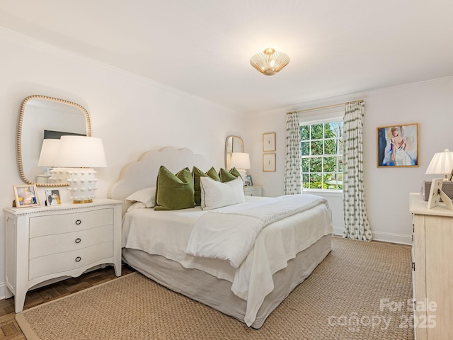 bedroom with crown molding and parquet flooring