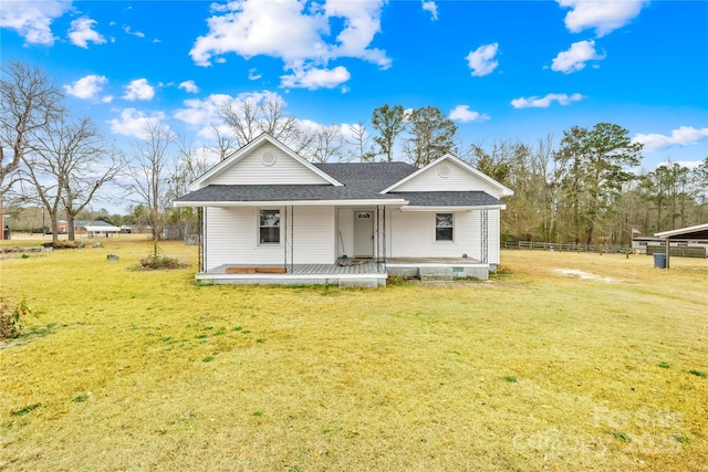 view of front of property with covered porch and a front lawn