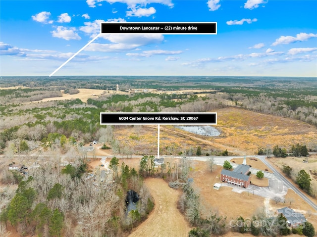 birds eye view of property featuring a rural view