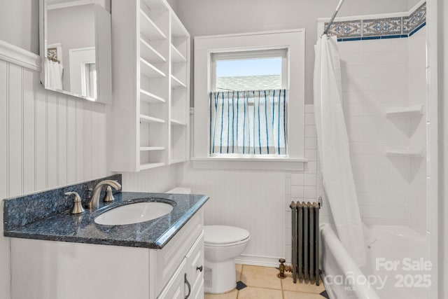 full bathroom with radiator, vanity, shower / bath combination with curtain, tile patterned floors, and toilet