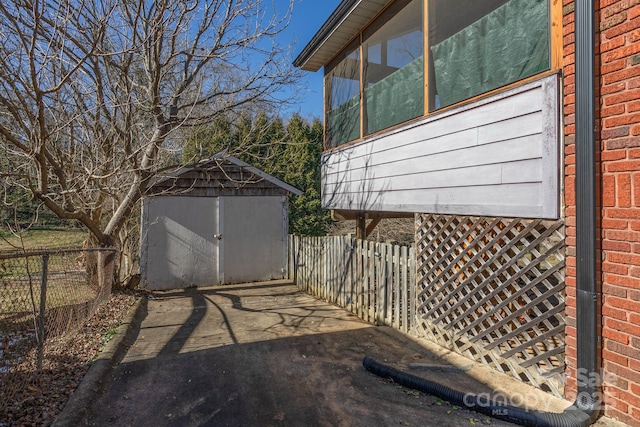 view of patio / terrace featuring a storage unit