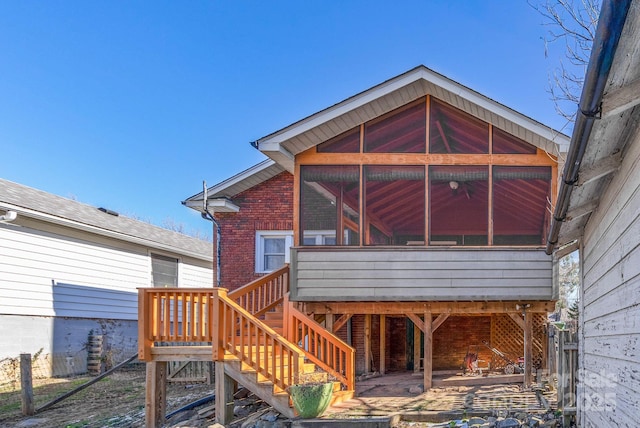 back of property featuring a sunroom