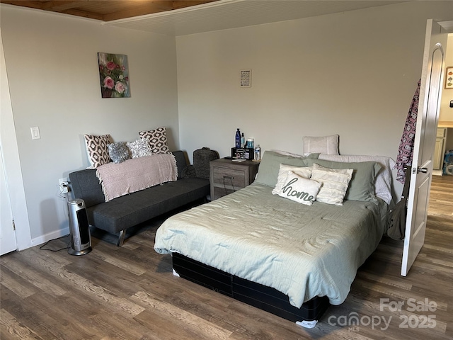 bedroom featuring dark hardwood / wood-style floors