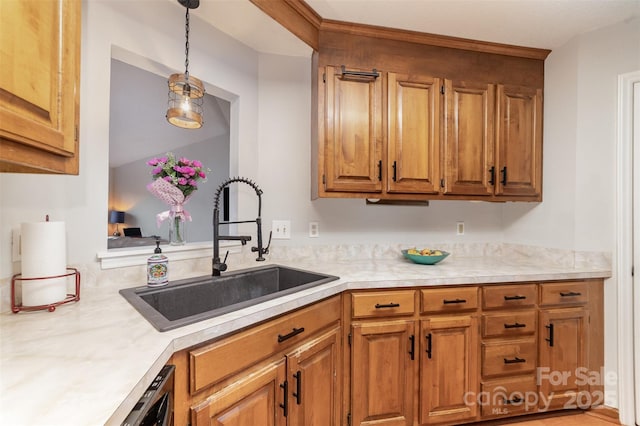 kitchen featuring sink and pendant lighting