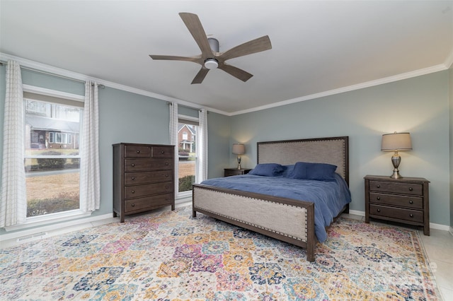 bedroom with multiple windows, ornamental molding, and ceiling fan