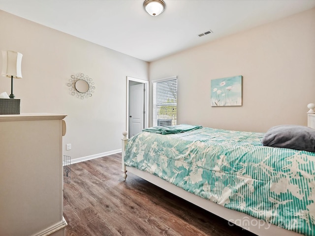 bedroom featuring wood-type flooring