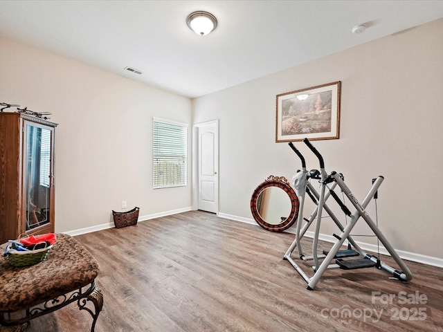 exercise room with hardwood / wood-style floors and a wealth of natural light