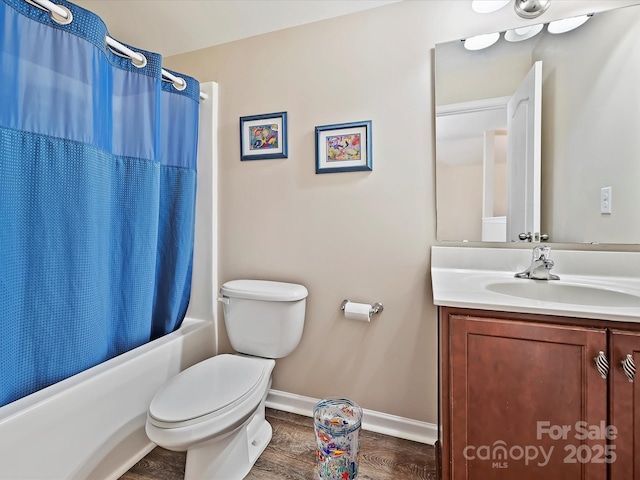 full bathroom with wood-type flooring, shower / bath combo, toilet, and vanity