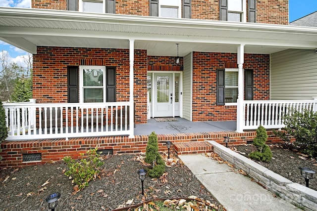 property entrance with covered porch