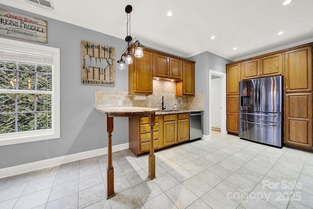 kitchen with appliances with stainless steel finishes, decorative light fixtures, backsplash, ornamental molding, and light stone counters