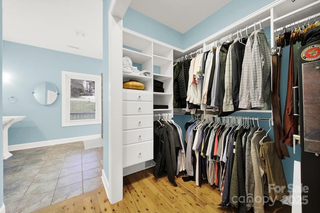 spacious closet featuring hardwood / wood-style flooring