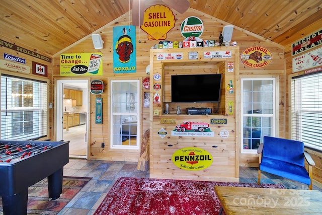 playroom featuring wooden ceiling, wooden walls, and lofted ceiling