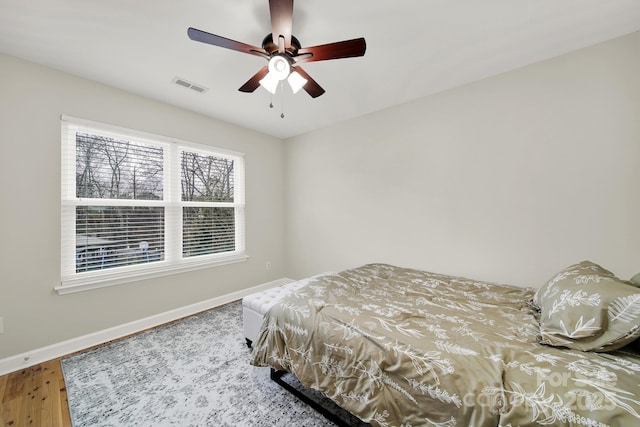 bedroom featuring ceiling fan and wood-type flooring