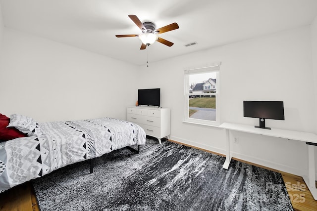 bedroom featuring ceiling fan and hardwood / wood-style floors