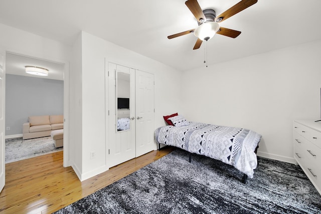 bedroom with a closet, ceiling fan, and hardwood / wood-style floors