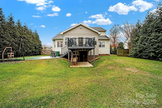 back of property featuring a pool side deck, a yard, and a patio