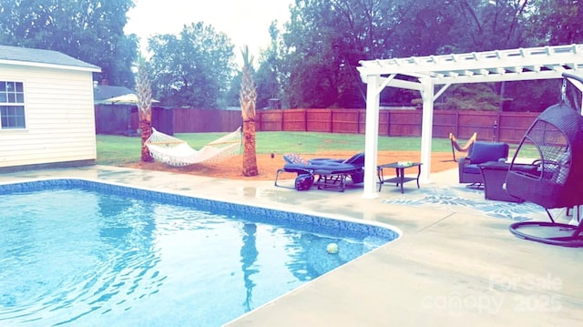 view of swimming pool featuring a pergola, a patio area, and a yard