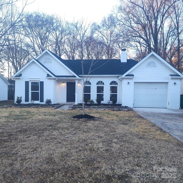 ranch-style home with a garage