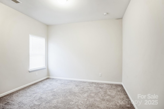 carpeted empty room with plenty of natural light