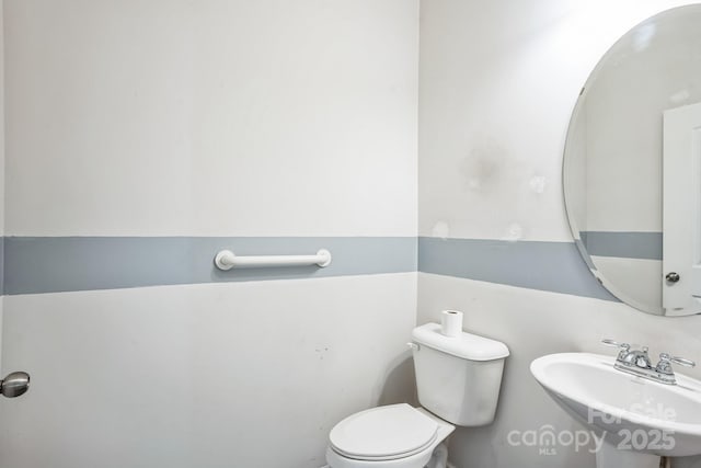 bathroom with sink and toilet