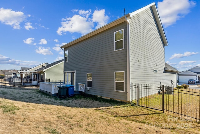 back of house with a yard