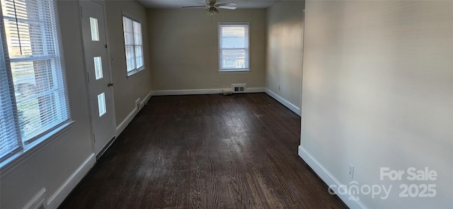 interior space with ceiling fan and dark hardwood / wood-style floors