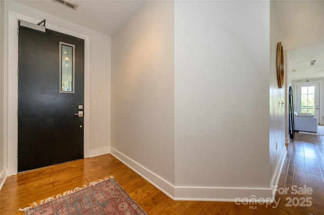 foyer entrance featuring hardwood / wood-style floors