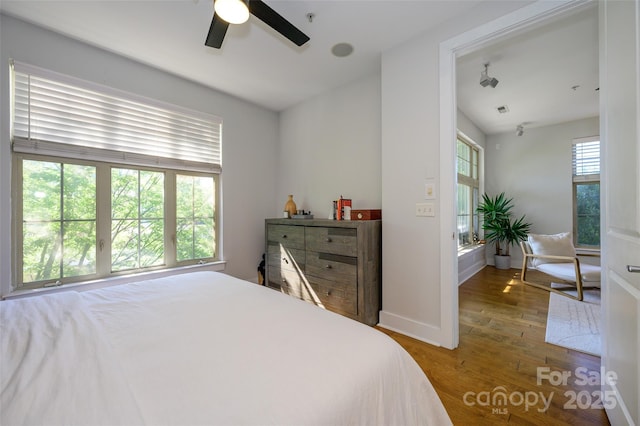 bedroom featuring ceiling fan and hardwood / wood-style flooring